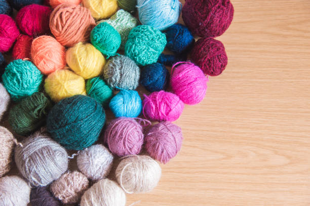 istock Balls of wool of different colors and empty space 1344611707