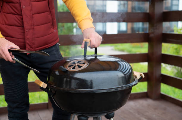 istock Man cooking a meal on the grill 1344613171