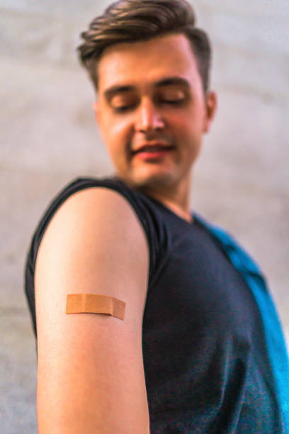 istock Vaccinated man with a adhesive plaster on his arm 1344613259