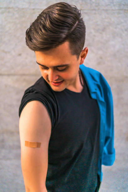 istock Vaccinated man with a adhesive plaster on his arm 1344614075