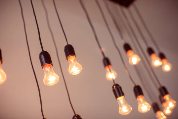 istock vintage light bulbs on black wires interior decoration 1344616173