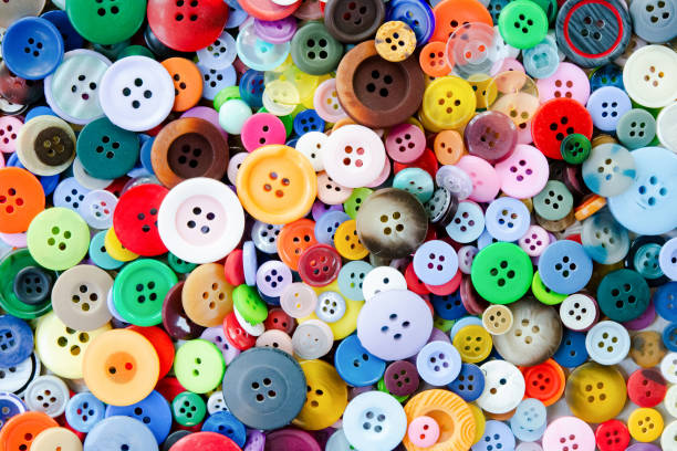 istock Colorful mixed sewing buttons background. Top view 1344617221
