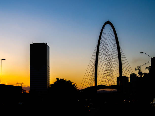 sunset with silhouette of the new cable-stayed bridge of são josé dos campos - cable stayed bridge imagens e fotografias de stock