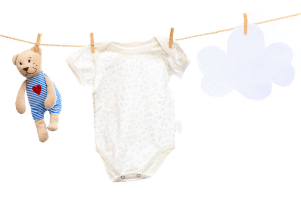 istock Baby clothes on a clothesline on white  background - Image 1344617548