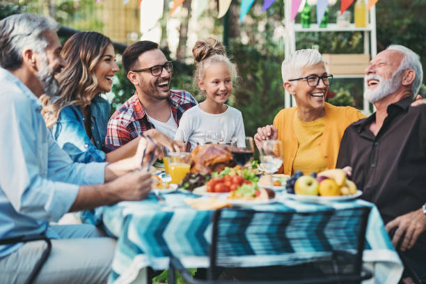 istock Multi-generation family enjoying Thanksgiving together 1344621229