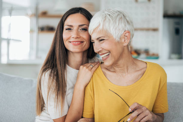 madre e figlia - senior adult child holding grandparent foto e immagini stock