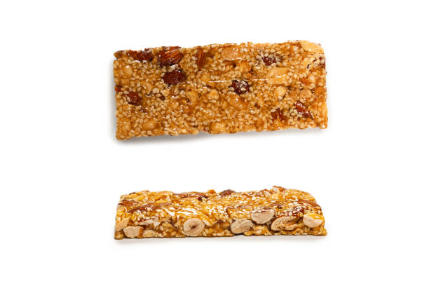 istock Bar with mix of nuts isolated on a white background. 1344622544