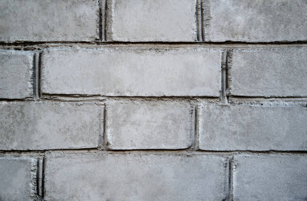 istock brick wall texture. White and gray brick wall background. Detail of a gray brick wall texture 1344627770