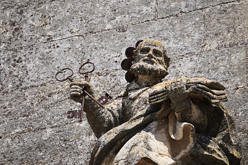 Ancient statue of St Peter holding crossed keys to the kingdom of heaven, Arcos de la Frontera, Cádiz, Spain