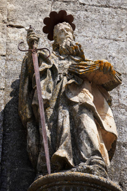 istock Ancient statue of Saint Paul holding a rusty sword and bible 1344629191