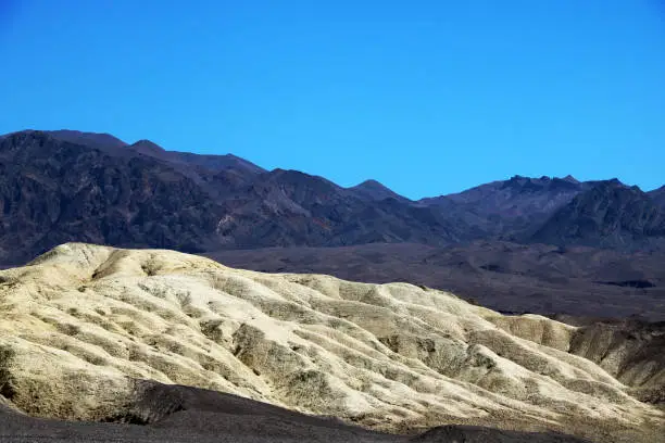 Photo of Historic Harmony Borax Works area. Exhibits along the trail include a 20 Mule Team Borax wagon train and the ruins of the old cottonball borate ore boiling facility.