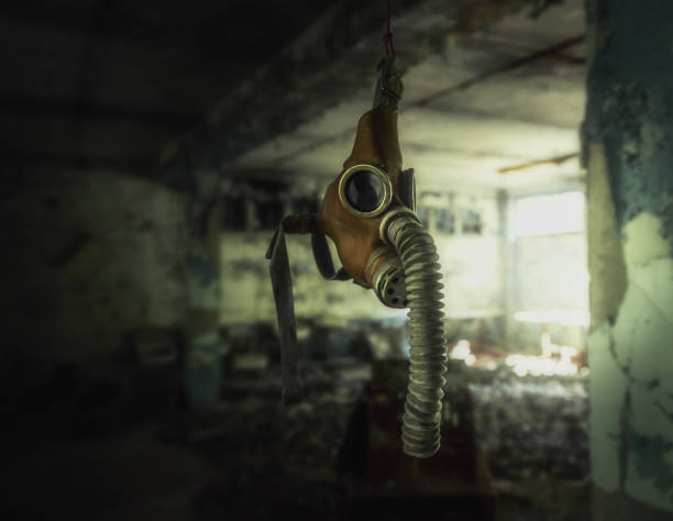 Gas mask hanging in an abandoned building - Pripyat, Chernobyl Exclusion Zone, Ukraine Gas mask hanging in an abandoned building - Pripyat, Chernobyl Exclusion Zone, Ukraine abandoned place photos stock pictures, royalty-free photos & images