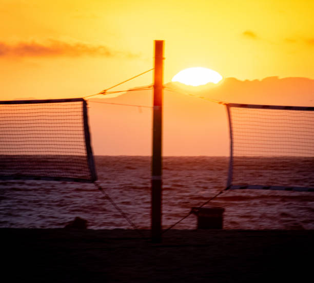 istock Sunset Over the Volleyball Courts 1344642844