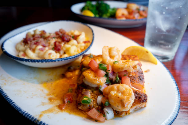 Grilled Salmon Topped, Sauteed Shrimp In A Delicious Cajun Sauce With A Side Of Three Cheese Macaroni Sprinkled With Crumbled Bacon