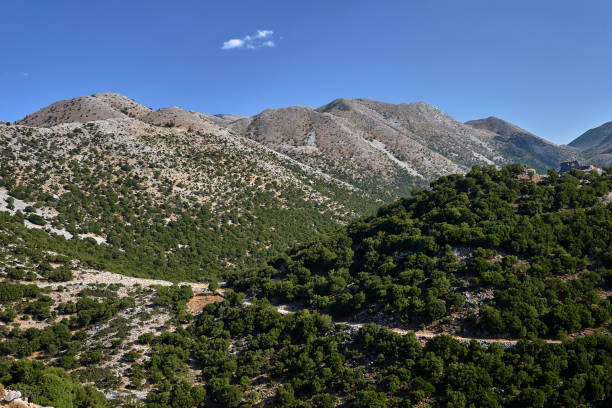 A valley and rocky peaks in the Lefka Ori mountains on the island of Crete A valley and rocky peaks in the Lefka Ori mountains on the island of Crete in Greece lefka ori photos stock pictures, royalty-free photos & images