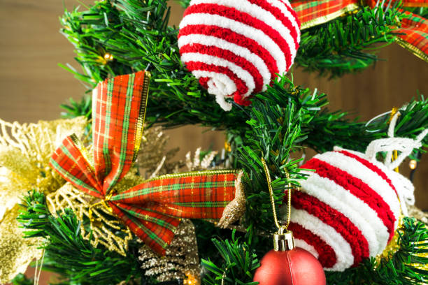 istock Christmas tree assembled with ornaments. Red, silver and gold balls, gift boxes, lights, Santa Claus and others. Selective focus 1344650164