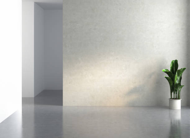 istock Empty room with concrete walls, concrete floor and soft skylight from window. 1344651567
