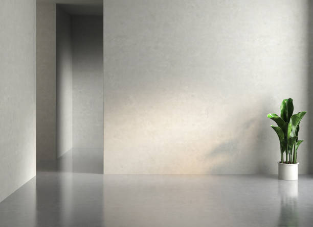 istock Empty room with concrete walls, concrete floor and soft skylight from window. 1344652090