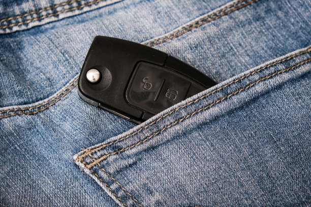 istock Car key, engine ignition key left in jeans pocket after coming home, weak security, high probability of the car being stolen 1344654367