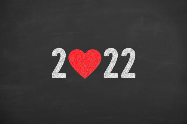 istock New Year 2022 with Heart Shape on Chalkboard Background 1344656193