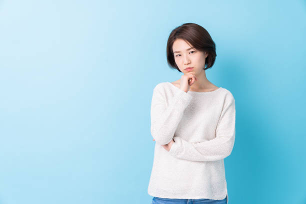istock attractive asian woman who thinks 1344666454