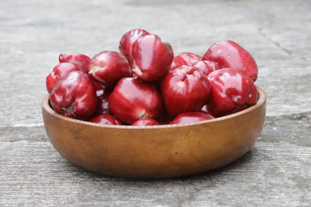 pile of water apples in a wooden bowl
