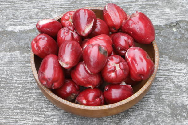 pile of water apples in a wooden bowl
