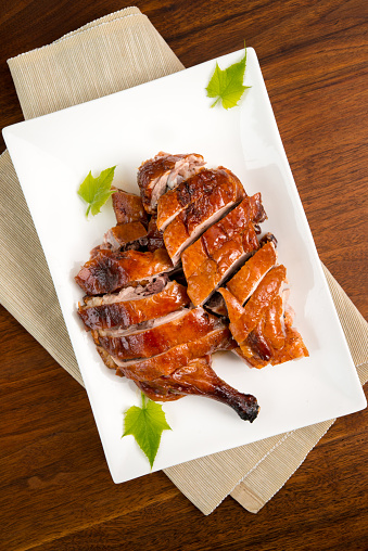 Cantonese style roast duck, roasted in hung oven with cavity filled with cooking liquid.