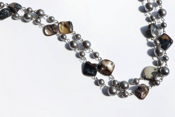 Beautiful handmade shell's necklace on white background.
