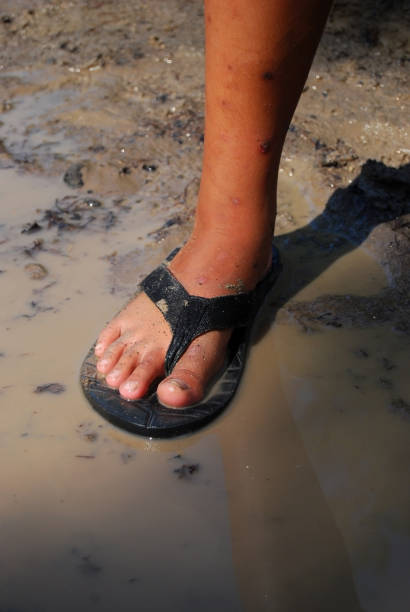 istock little boy playing dirty water 1344680711