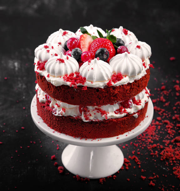 Delicious homemade red velvet cake Delicious homemade red velvet cake with meringue and mascarpone cream on black background. Top view, copy space cream cake stock pictures, royalty-free photos & images