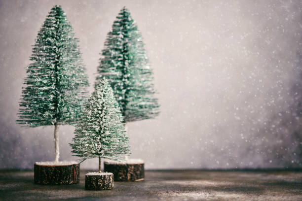 istock Modern Christmas Background with Cute Christmas Trees in Snow 1344687590