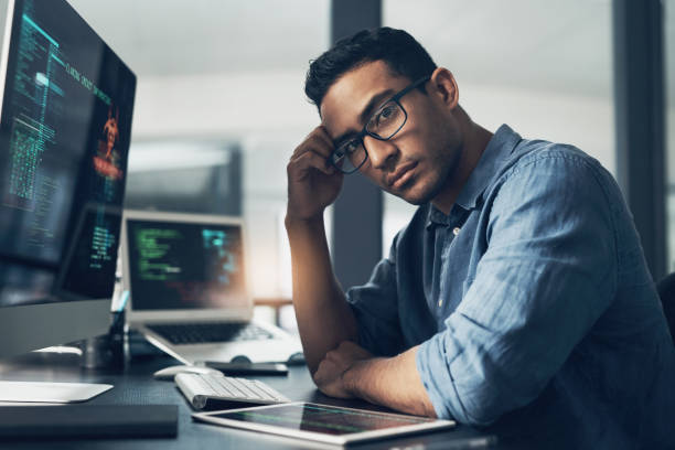 istock Portrait of a man using a computer in a modern office 1344688158