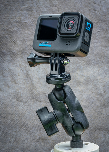 Fort Collins, CO, USA - October 3, 2021: GoPro Hero 10 black, waterproof action camera on a popular articulated RAM mount, studio shot.