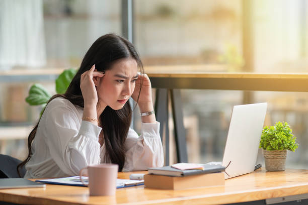 istock Asian businesswoman gets stressed while having a problem at work in the office. 1344692869
