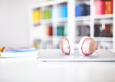 Rose Gold Headphones in Home Office on Desk with Laptop