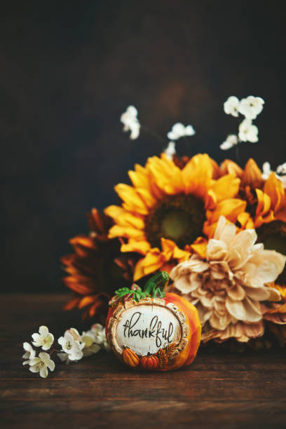 istock Fall Arrangement with Sunflower Bouquet and Pumpkin 1344694830