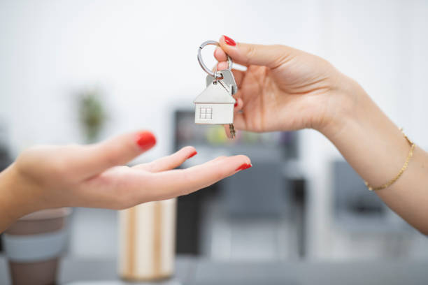 istock hands handing over keys for property purchase 1344695939