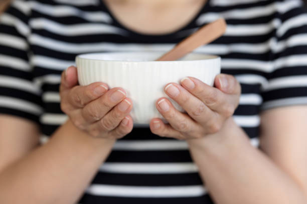 istock Close-up on a bowl being held by a woman 1344697216