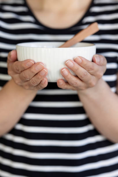 istock Close-up on a bowl being held by a woman 1344698285