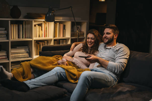 istock friends enjoying time at home 1344699331