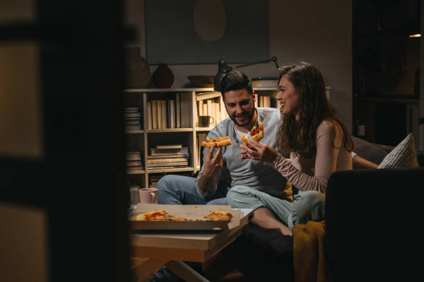 istock friends enjoying time at home 1344699391