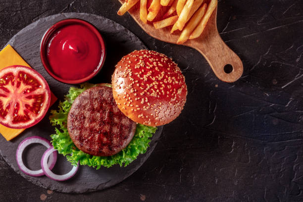 istock Hamburger ingredients, overhead flat lay shot with copy space. Beef patty steak 1344699569