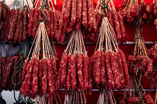 Street trade in Chinatown. Smoked Chinese red sausages.