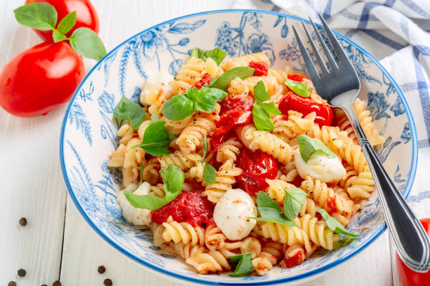 istock Pasta with baked caprese. 1344706093