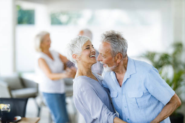 istock Happy mature couple enjoying in dancing on a party. 1344707144
