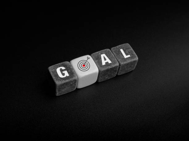 istock Goals concept. Goal, word and target icon sign on black and white cube blocks. 1344708370