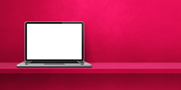 istock Laptop computer on pink shelf background banner 1344709396