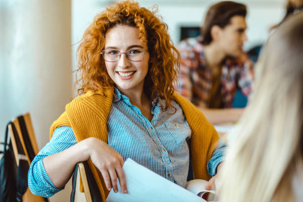 istock Happy female student in the classroom. 1344710084