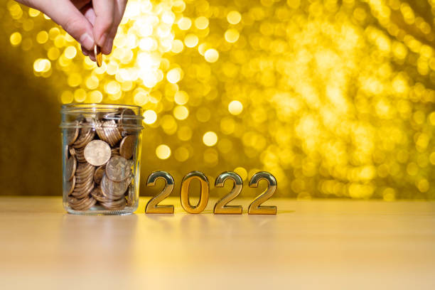 istock 2022 new year and coin jar on the table 1344710963